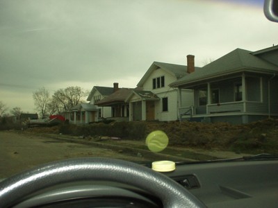 Pulling onto Dacey Ave. The houses look rather sad. Their windows missing makes it look like the eyes to their soul have been removed.